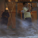 A man takes pictures against strong wind caused by typhoon Hato at a housing area in Hong Kong, Wednesday, Aug. 23, 2017. A powerful typhoon barreled into Hong Kong on Wednesday, forcing offices and schools to close and leaving flooded streets, shattered windows and hundreds of canceled flights in its wake. (Apple Daily via AP)